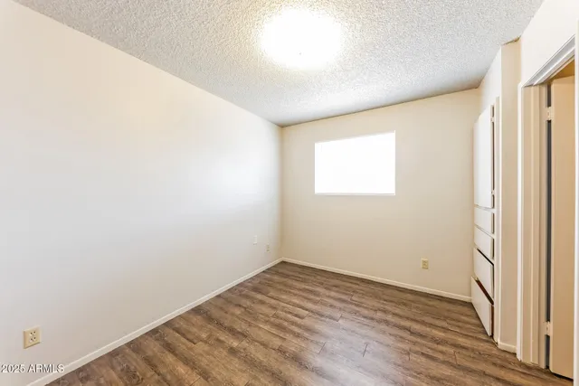 a kitchen with a stove a sink and cabinets