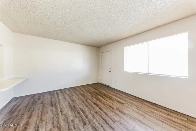 a view of a kitchen with wooden floor