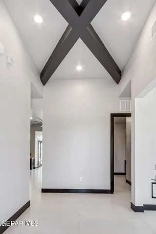 a view of a hallway with wooden floor and dining room