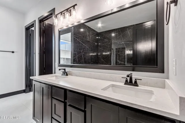 a bathroom with a tub and shower