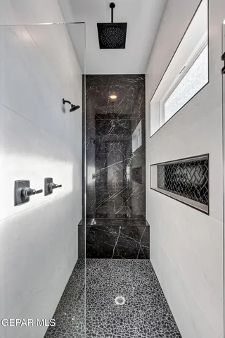 a living room with stainless steel appliances kitchen island furniture and a view of kitchen