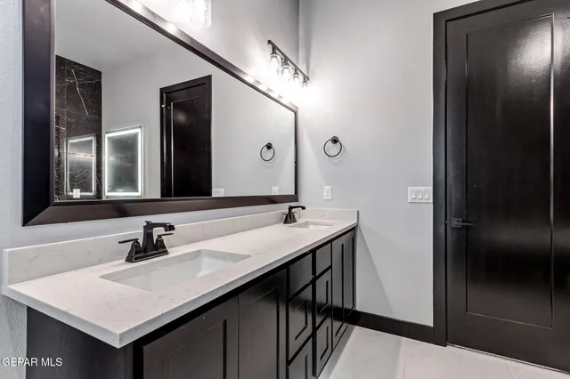 a kitchen with a stove a refrigerator and a microwave