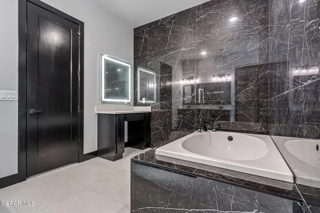 a kitchen with stainless steel appliances granite countertop a stove and a kitchen island