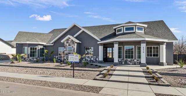 a front view of a house with a porch