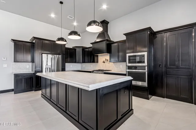 a large kitchen with a large island in it