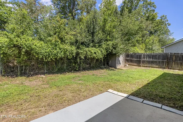 a backyard of a house with lots of green space