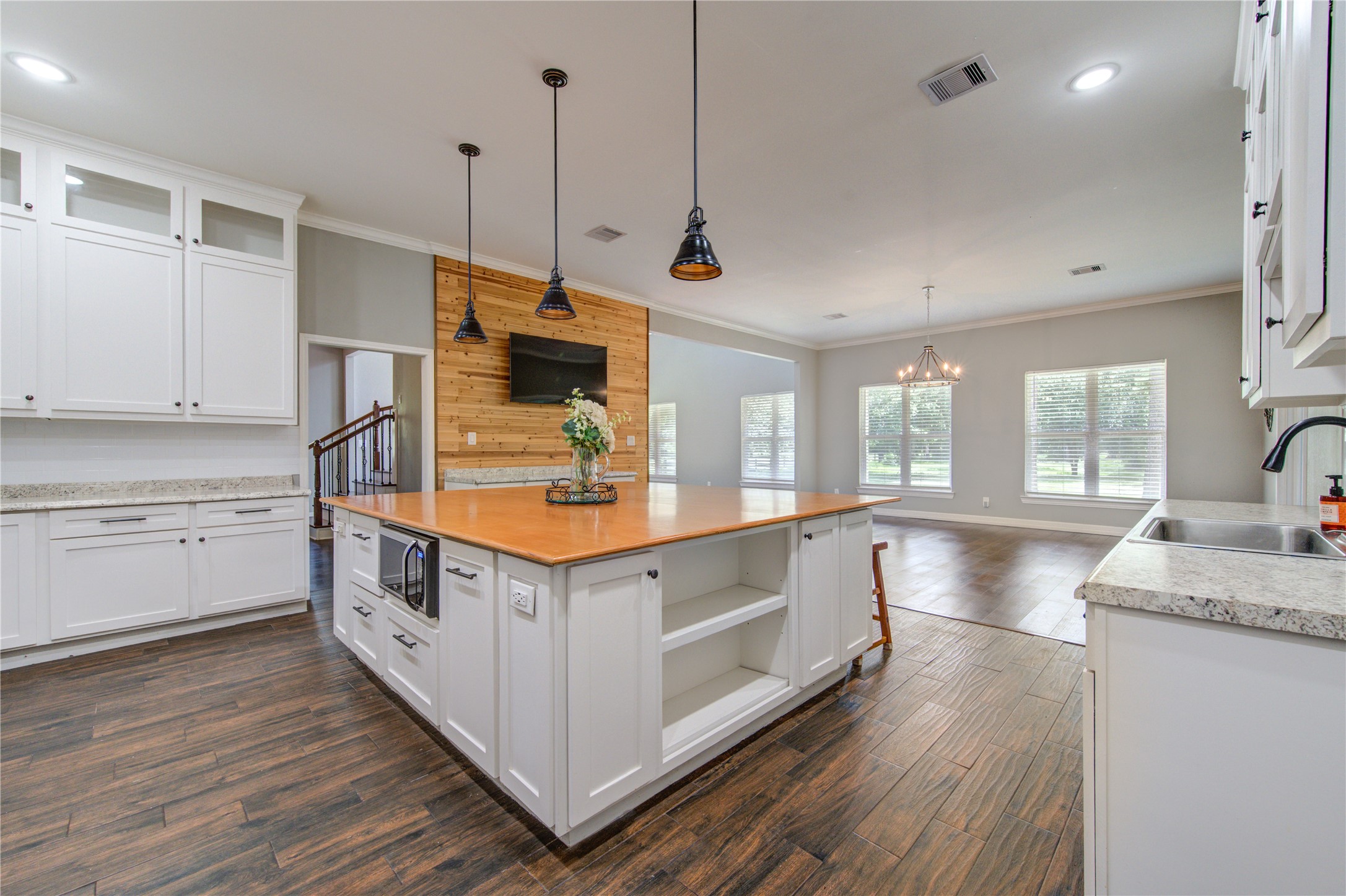 20531 Faye Tomball, TX 77377 - Photo 17 of 43 a kitchen with stainless steel appliances granite countertop a sink a stove and a wooden floors