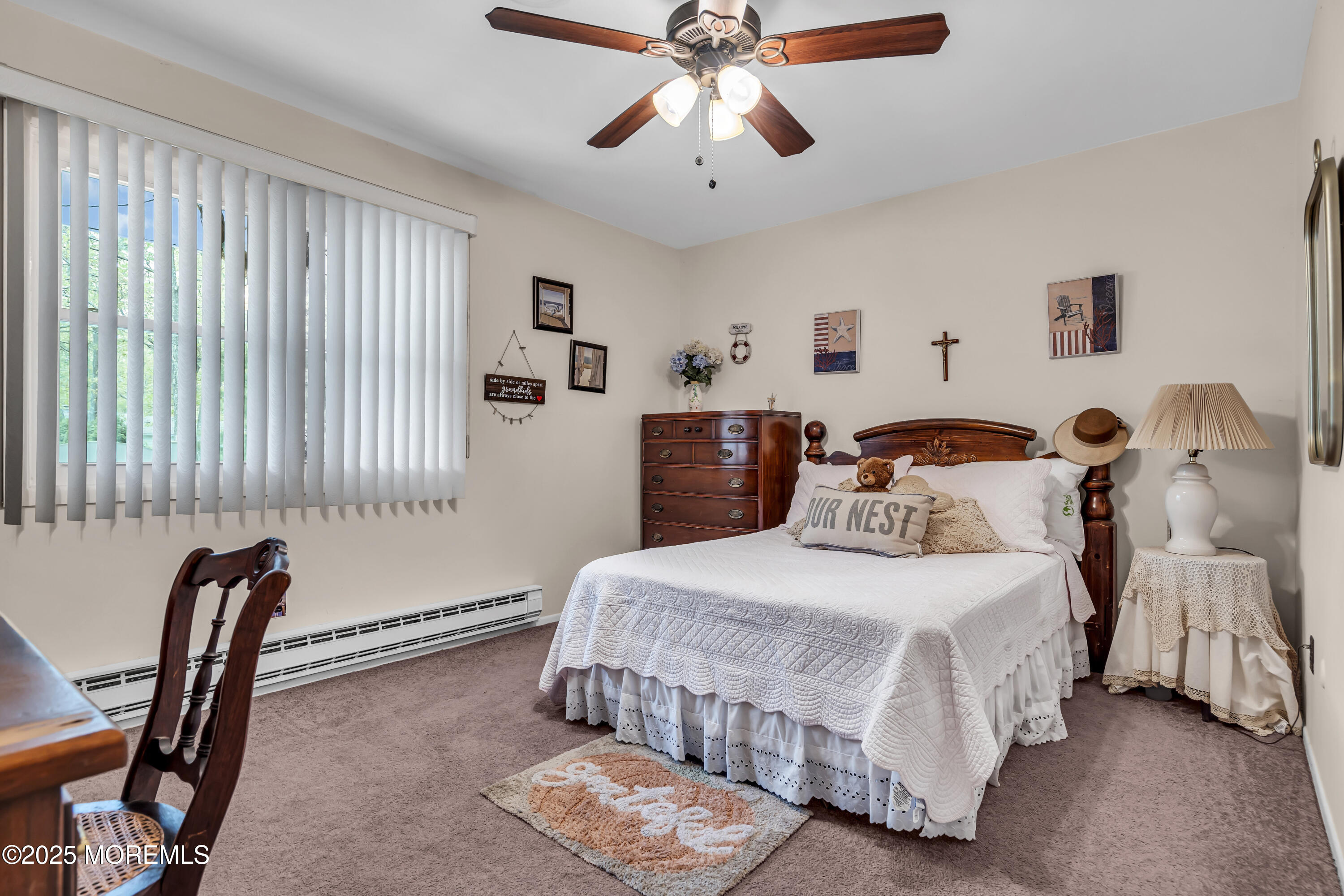 2 Oregon Drive, Unit A Whiting, NJ 08759 - Photo 19 of 26 a bedroom with a bed and a chandelier