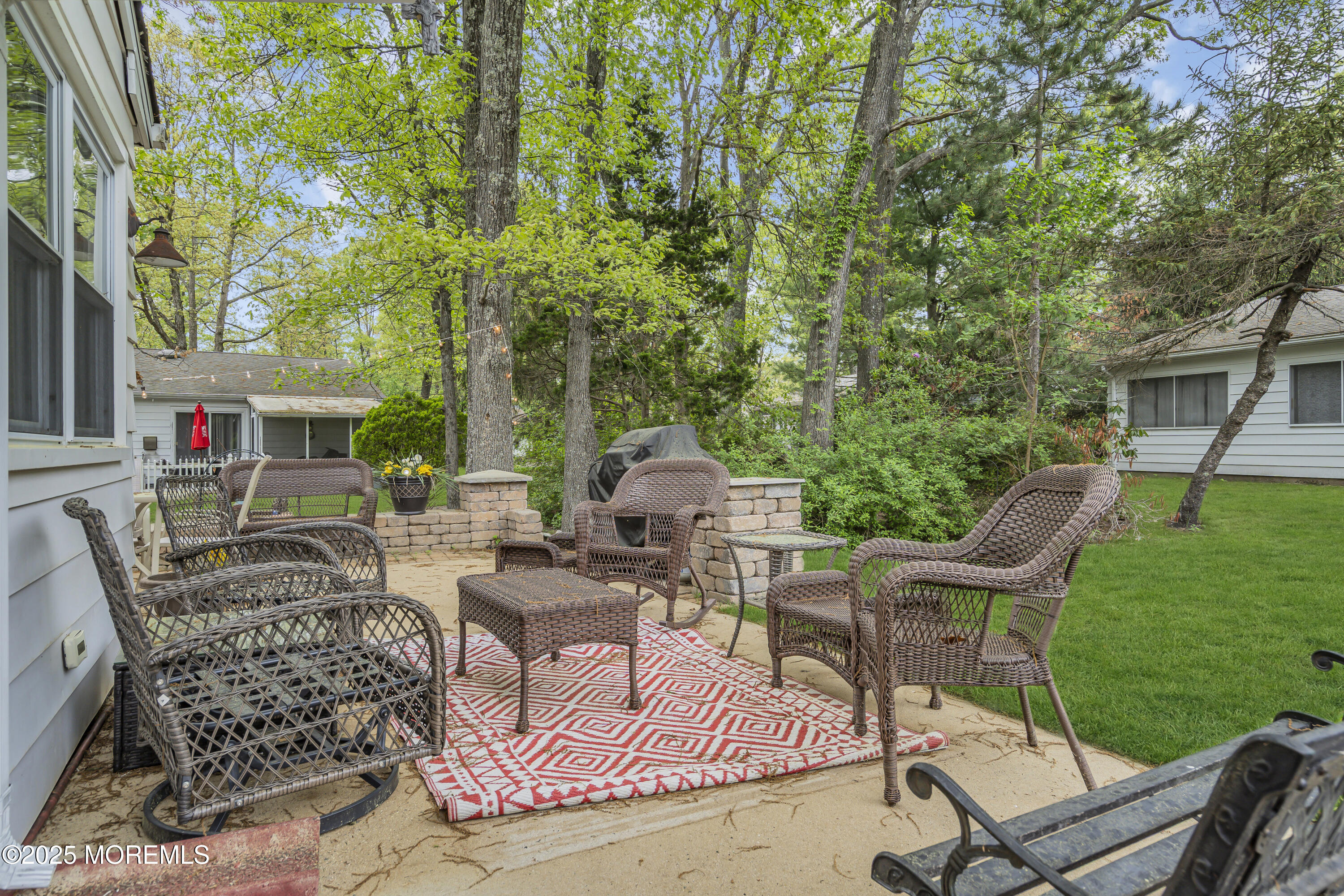 2 Oregon Drive, Unit A Whiting, NJ 08759 - Photo 22 of 26 a view of a patio with table and chairs and potted plants