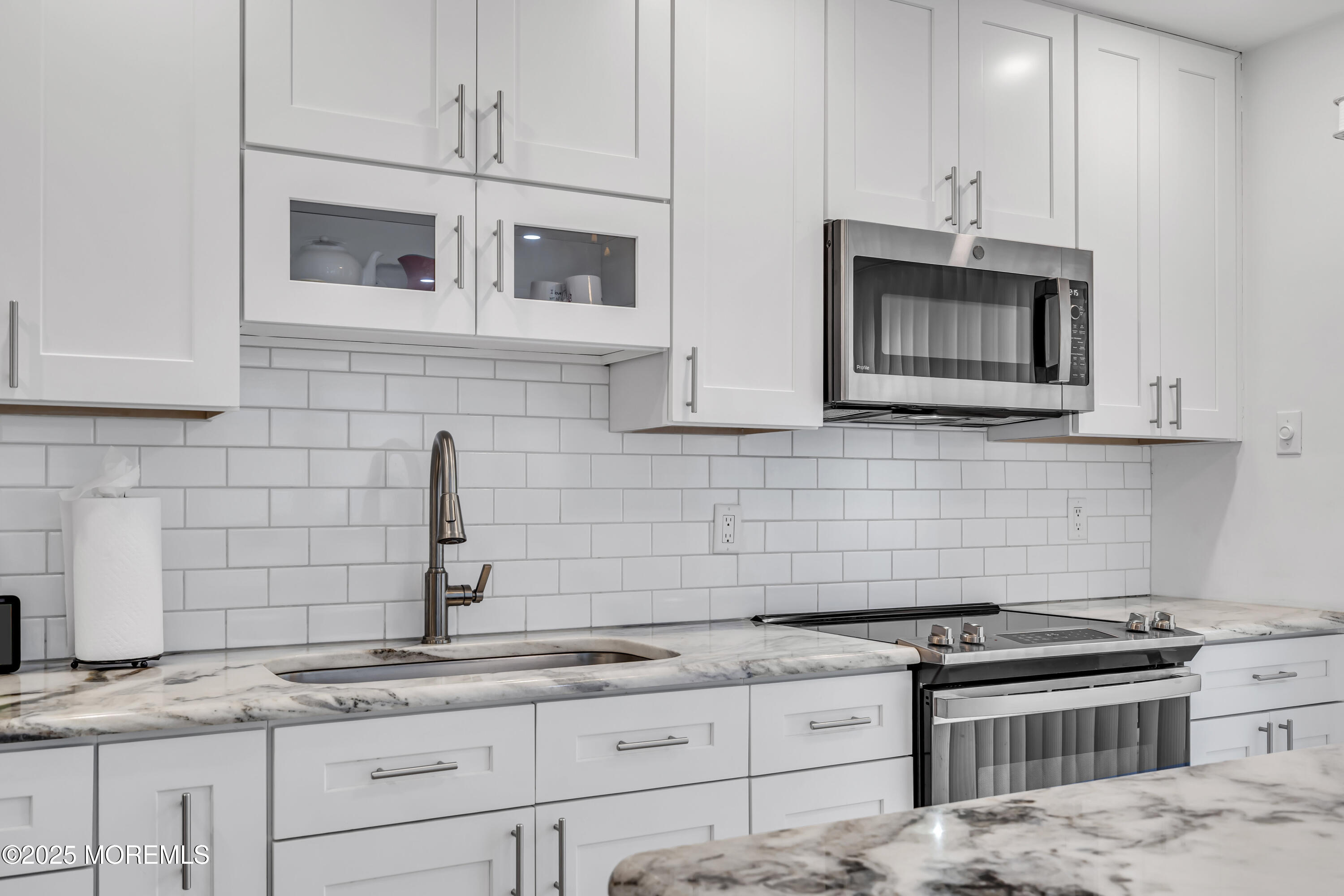 2 Oregon Drive, Unit A Whiting, NJ 08759 - Photo 9 of 26 a kitchen with stainless steel appliances granite countertop white cabinets a stove a sink and dishwasher