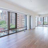wooden floor in an empty room with windows