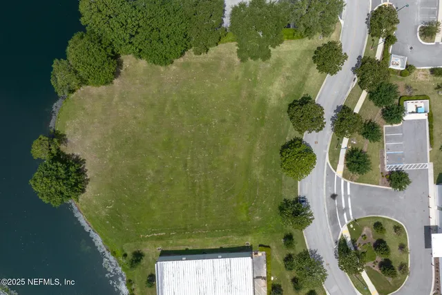 an aerial view of a house with yard swimming pool and outdoor seating
