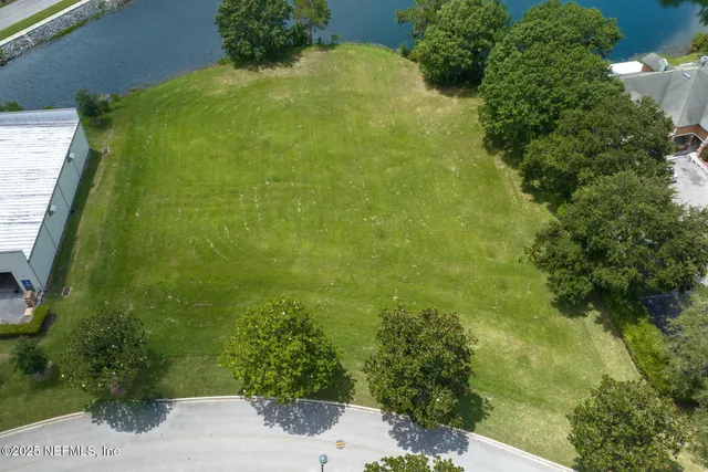 an aerial view of a residential houses with outdoor space