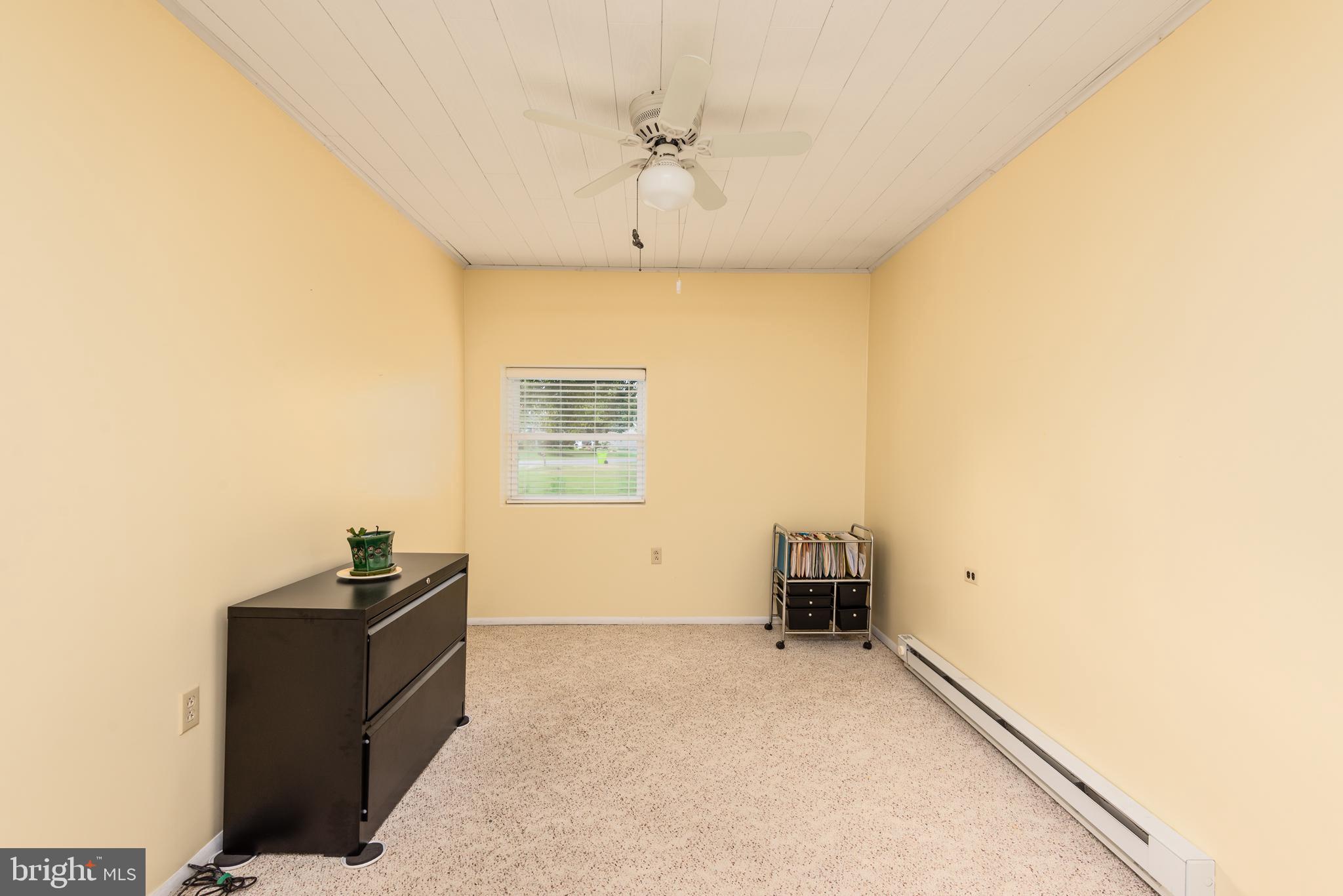 1401 Calvert Road Chester, MD 21619 - Photo 18 of 33 a view of a livingroom with furniture and a ceiling fan