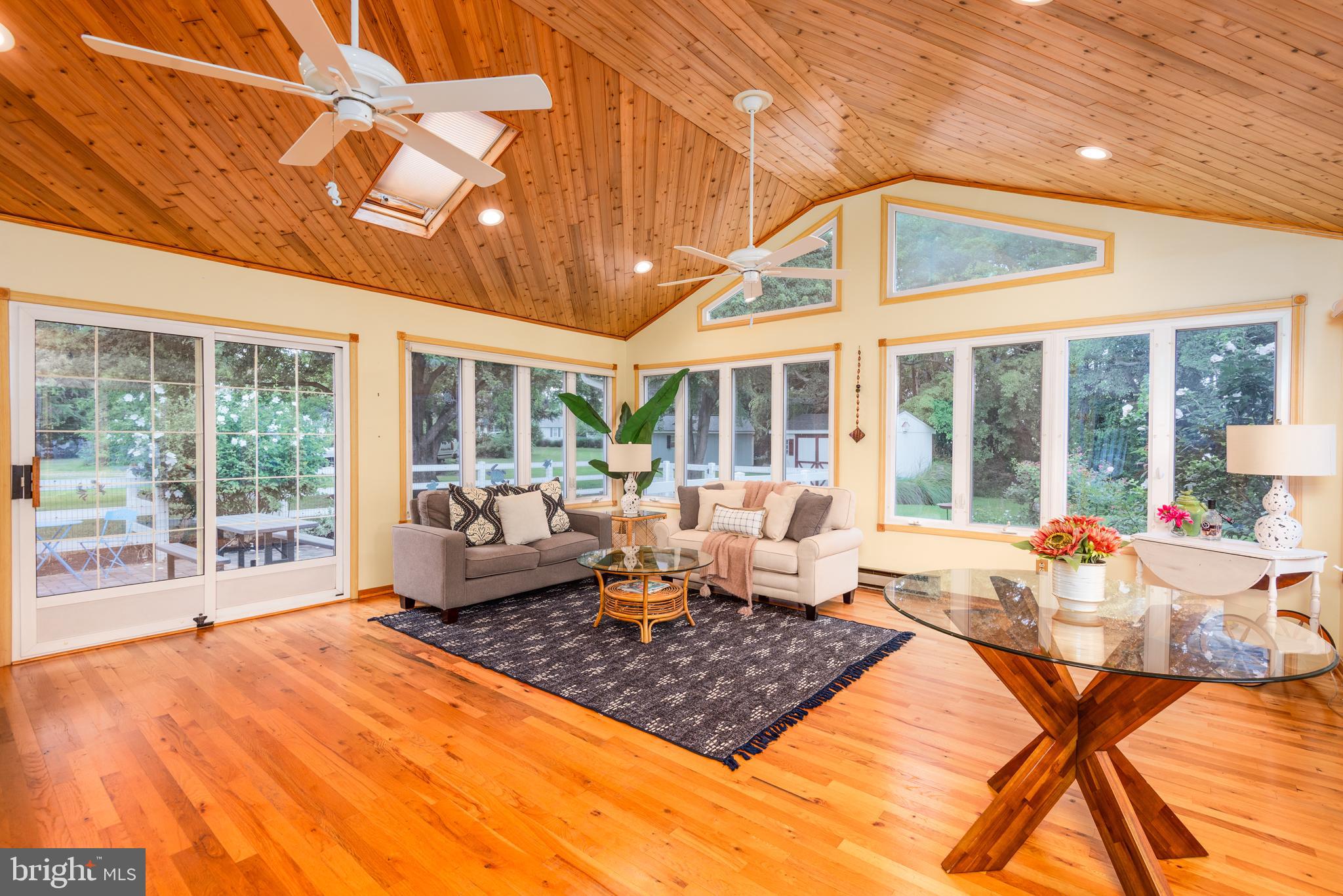 1401 Calvert Road Chester, MD 21619 - Photo 2 of 33 a living room with furniture a large window and chandelier