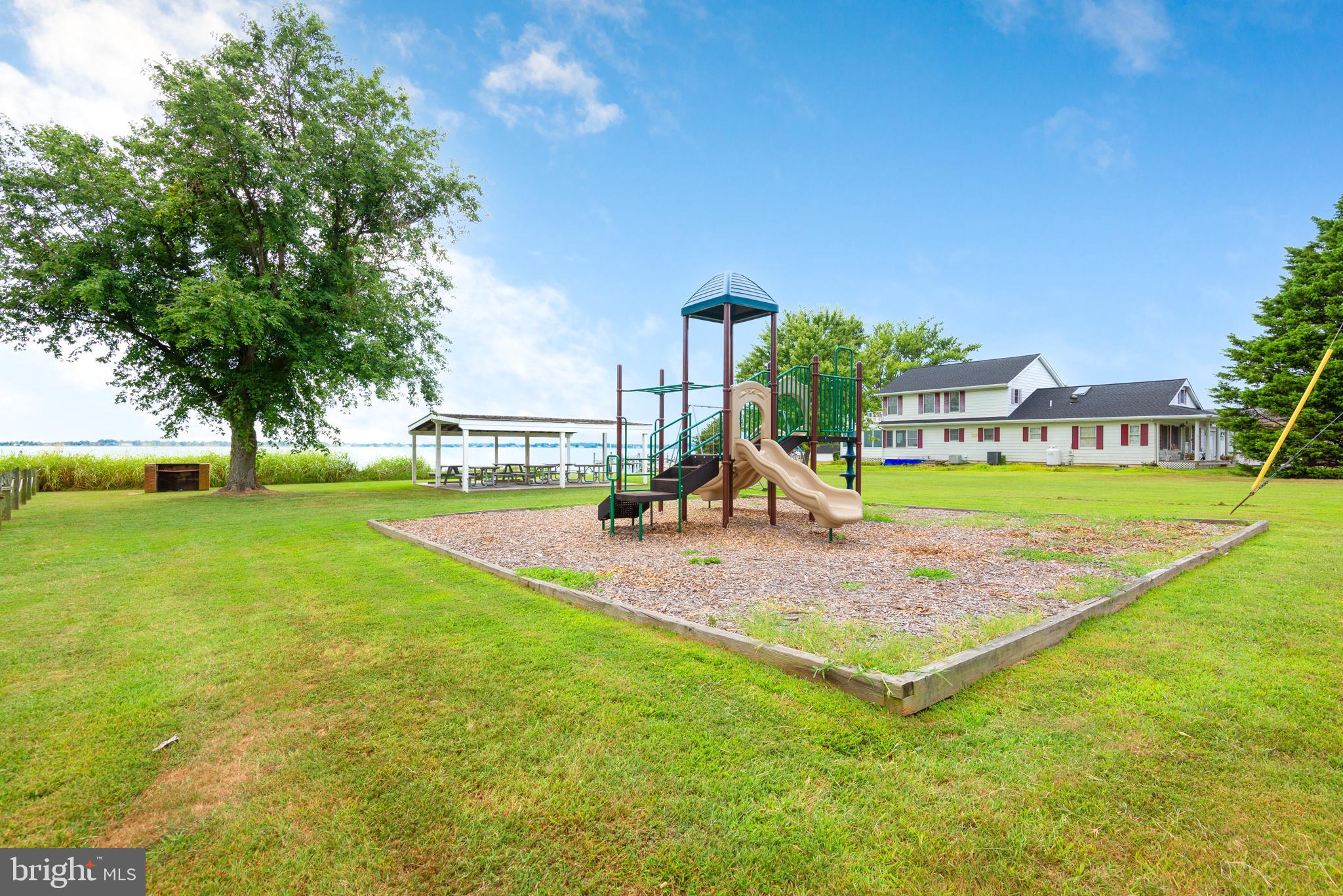 1401 Calvert Road Chester, MD 21619 - Photo 31 of 33 a view of a park with swings and slides