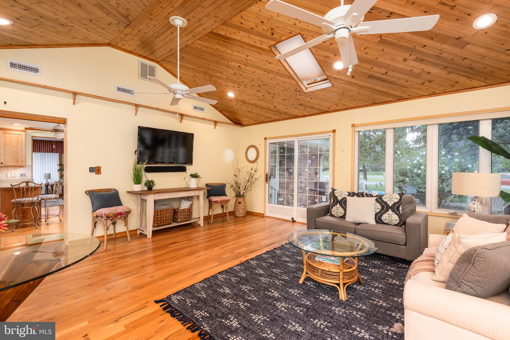1401 Calvert Road Chester, MD 21619 - Photo 4 of 33 a living room with patio furniture and a flat screen tv