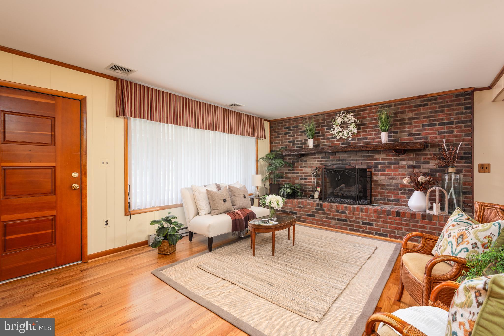 1401 Calvert Road Chester, MD 21619 - Photo 9 of 33 a living room with furniture and a fireplace