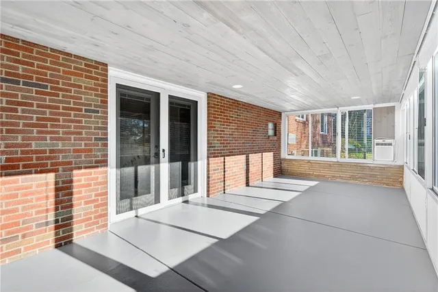 a view of an entryway with wooden floor