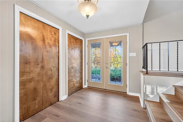 a view of entryway with wooden floor