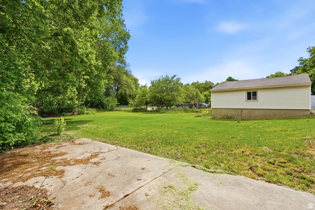 778 East 200 North Logan, UT 84321 - Photo 7 of 43 Expansive grassy yard with mature trees