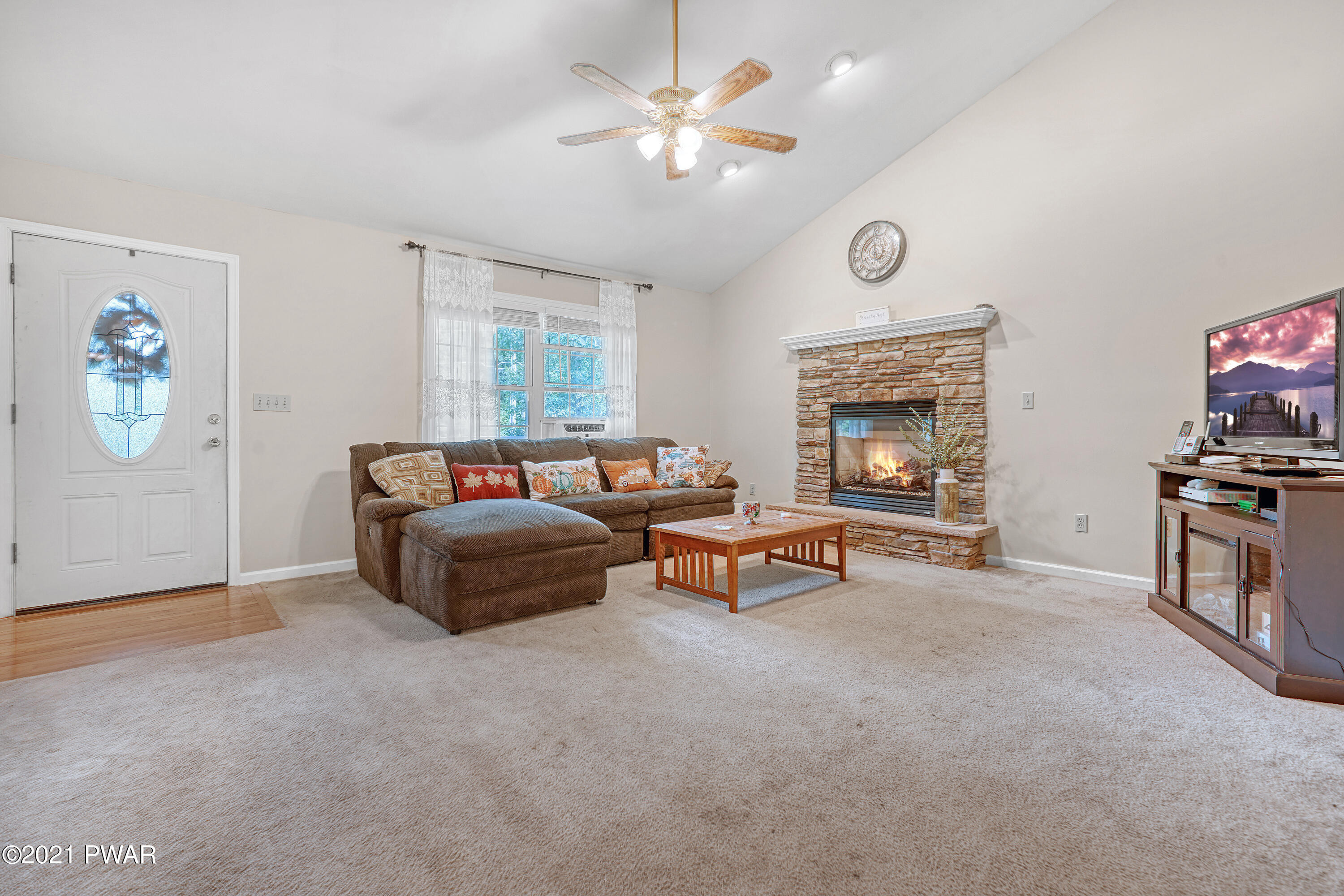 125 Forest Road Dingmans Ferry, PA 18328 - Photo 15 of 28 a bedroom with furniture and a fireplace