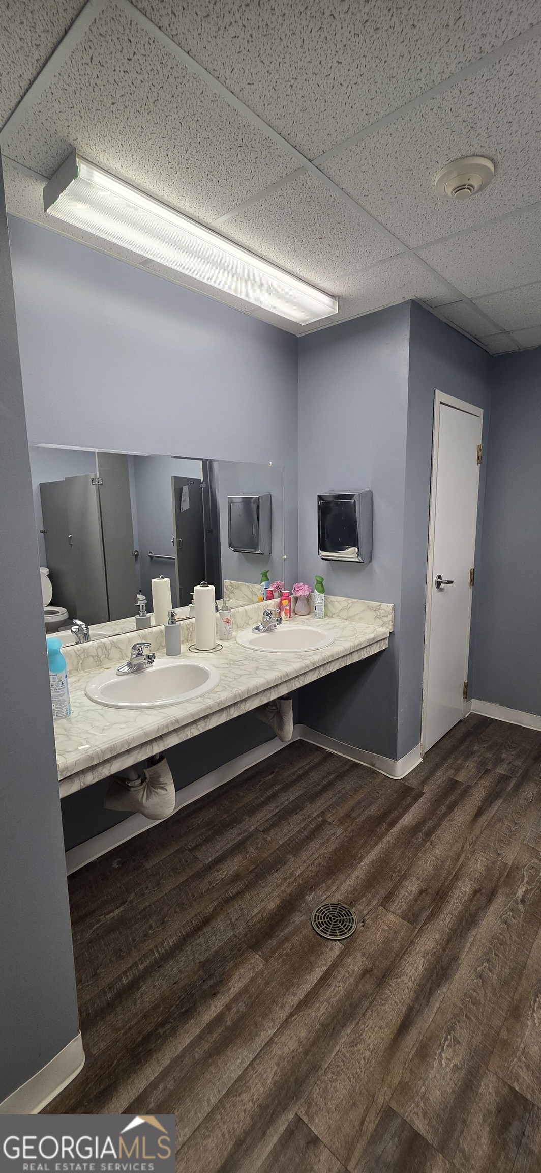 6270 Red Oak Road Atlanta, GA 30349 - Photo 16 of 43 a bathroom with a sink a large mirror and vanity