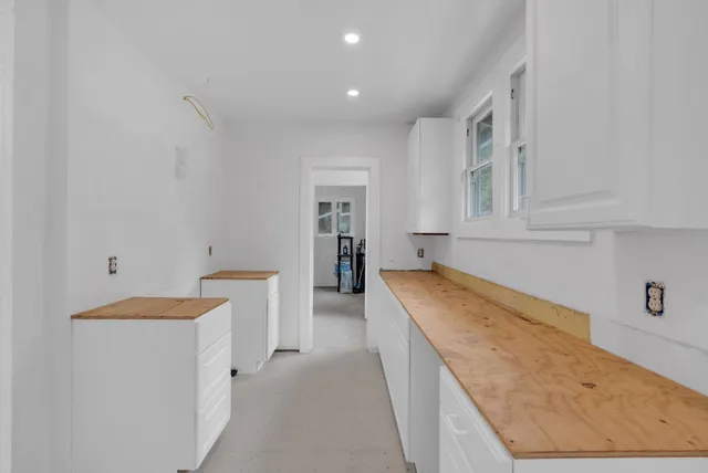 a hallway with washer and dryer