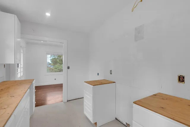a view of a kitchen cabinets and a sink
