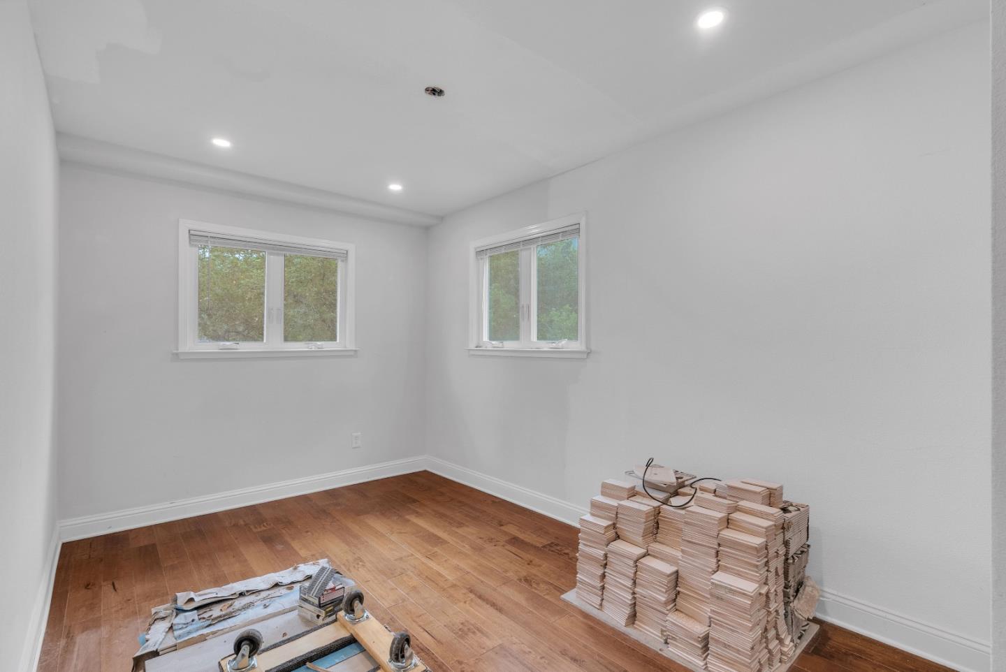 19000 Overlook Road Los Gatos, CA 95030 - Photo 27 of 56 a room with wooden floor and lounge chair