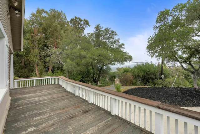 an aerial view of residential house with green space