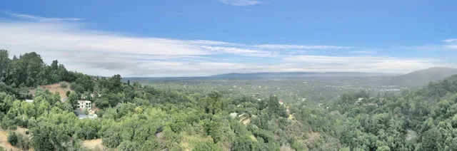 a aerial view of a house with a yard