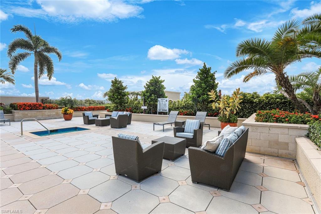 9123 Strada Place, Unit 7201 Naples, FL 34108 - Photo 29 of 50 a view of a patio with couches and chairs