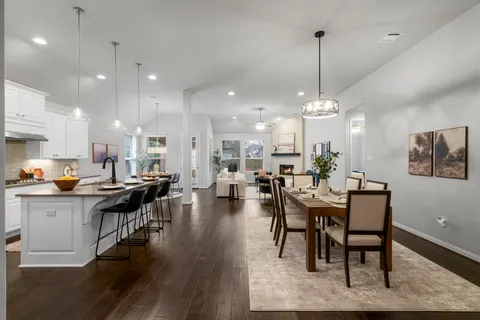 a view of a dining area with furniture and wooden floor