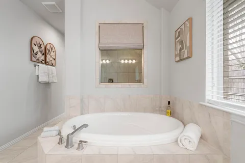 a white bath tub sitting in a bathroom