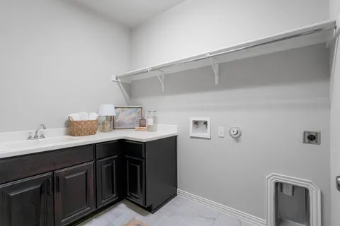 a utility room with cabinets