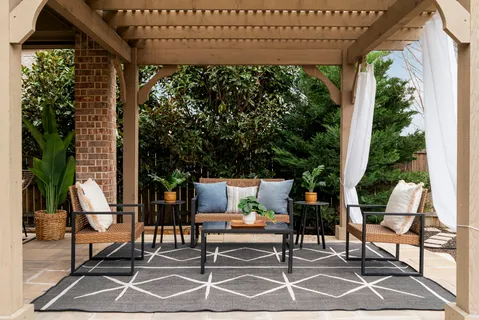 a sitting area with furniture and a potted plant