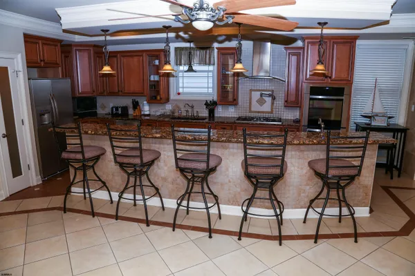a kitchen with a table and chairs in it