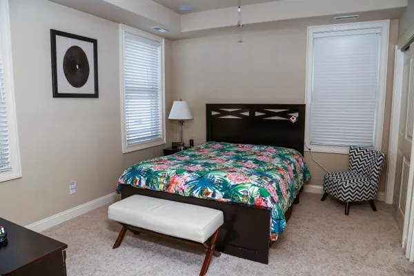 a bedroom with a bed and a fireplace