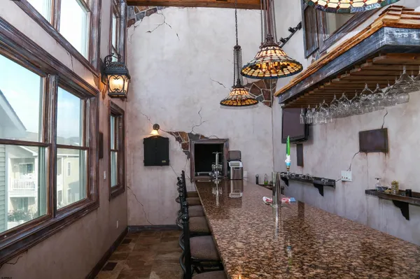 a floor to ceiling window and a rug