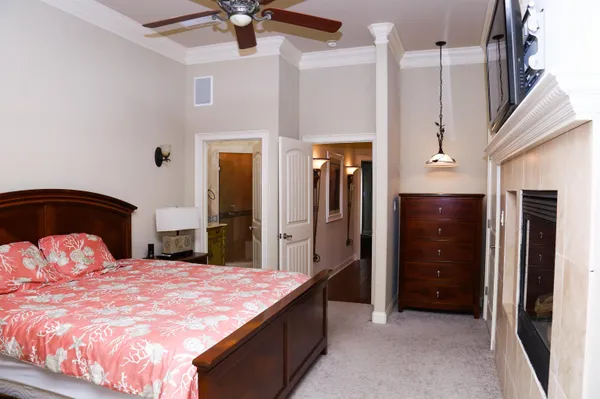 a bedroom with a large bed and a dresser