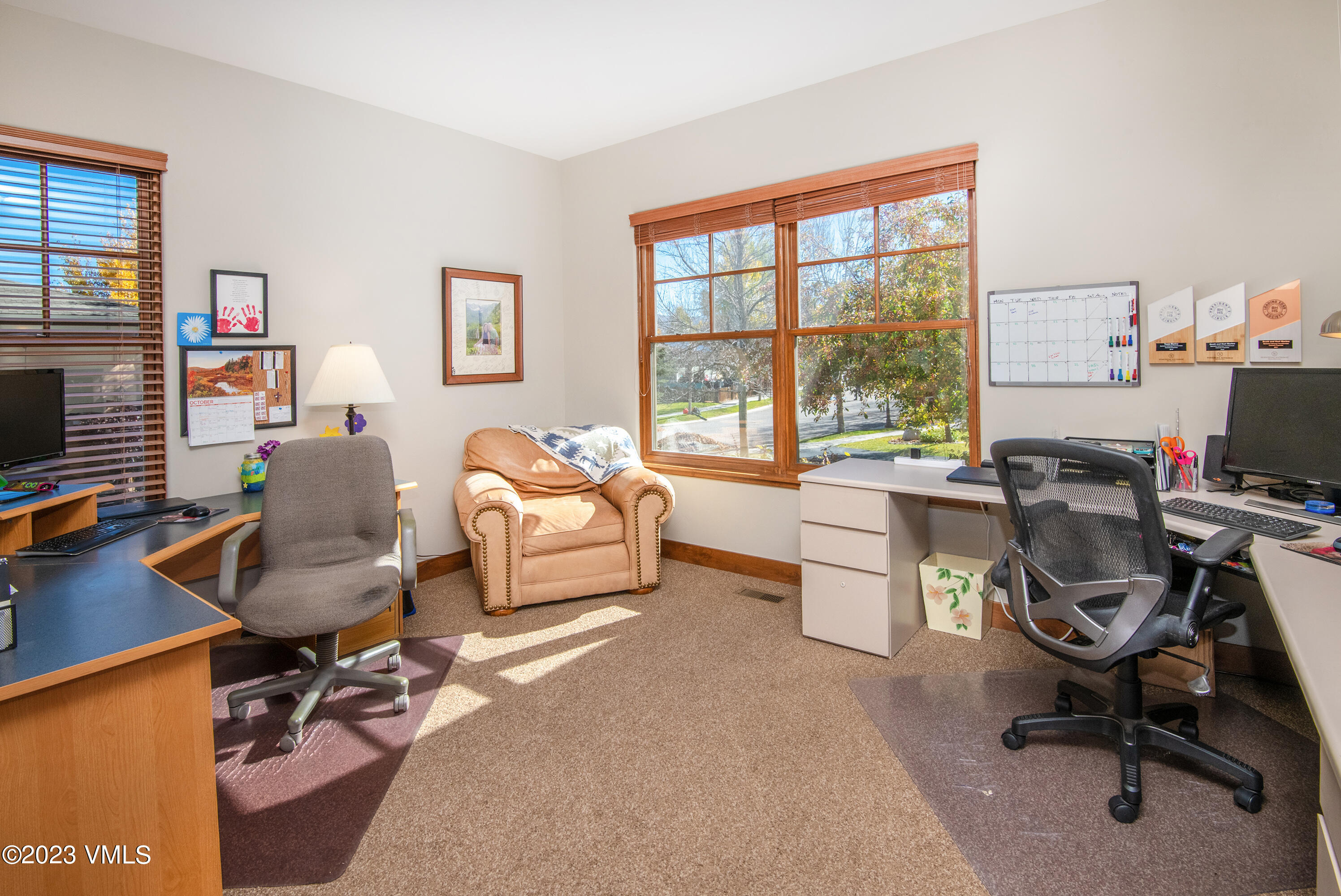 346 Palmer Loop Eagle, CO 81631 - Photo 22 of 63 a work room with furniture a flat screen tv and a window