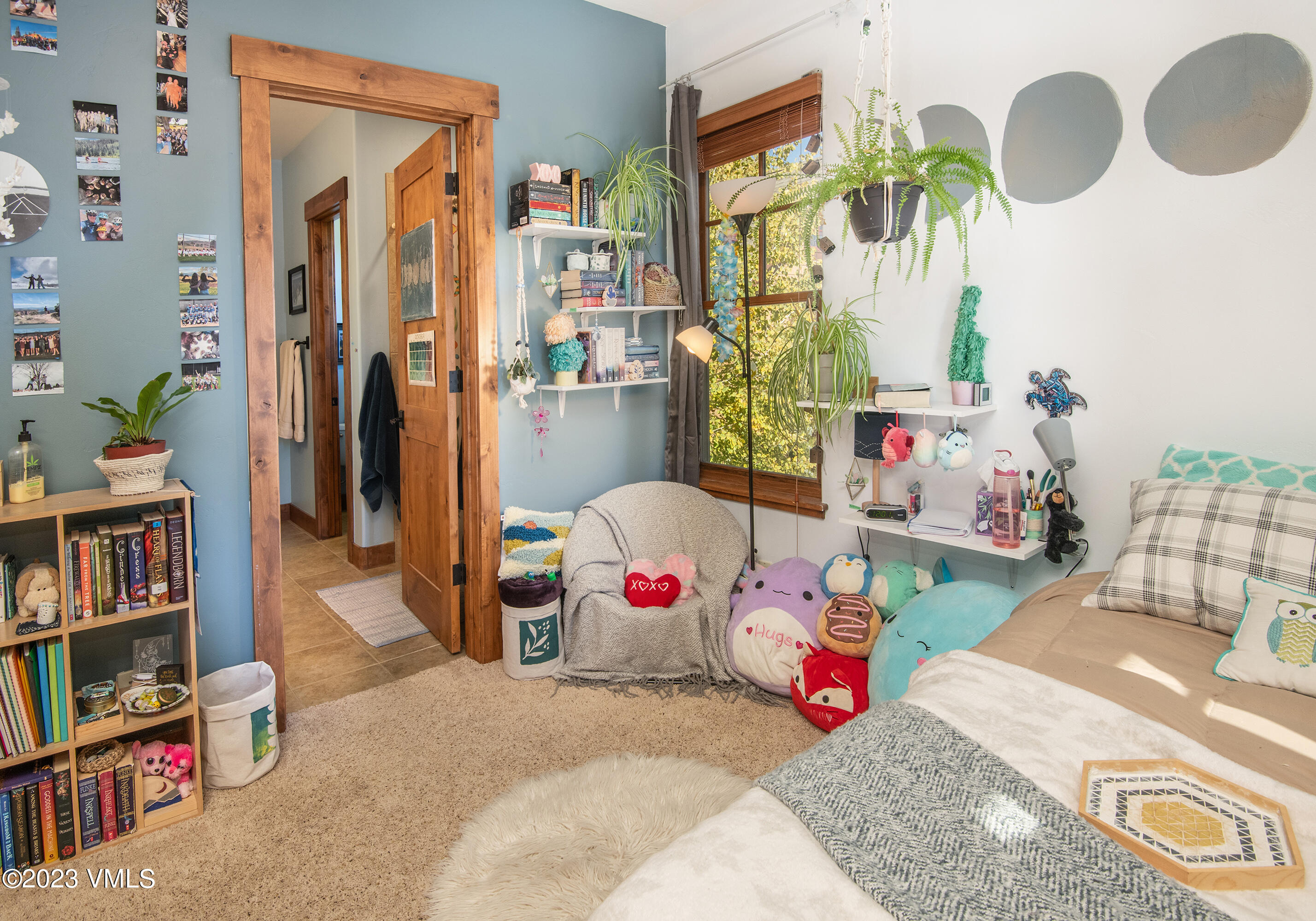 346 Palmer Loop Eagle, CO 81631 - Photo 27 of 63 a bedroom with furniture and a book shelf