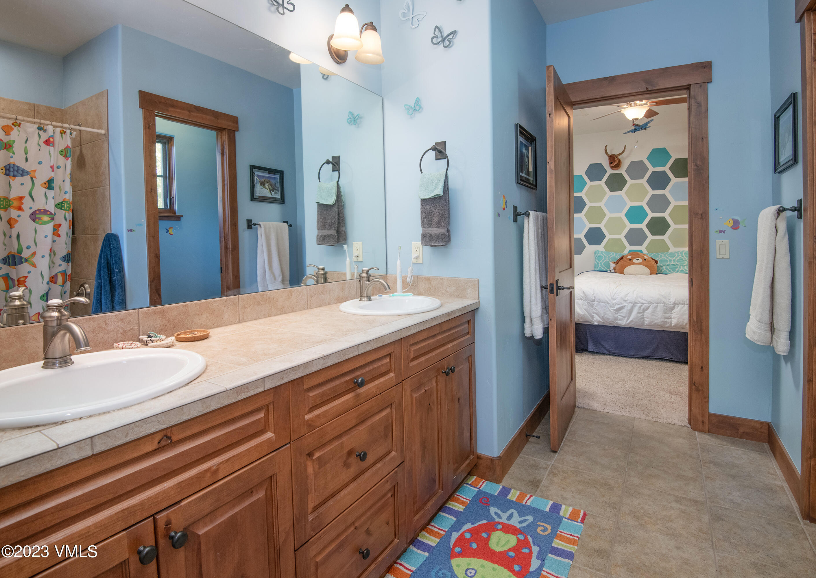 346 Palmer Loop Eagle, CO 81631 - Photo 29 of 63 a bathroom with a sink a vanity and a mirror