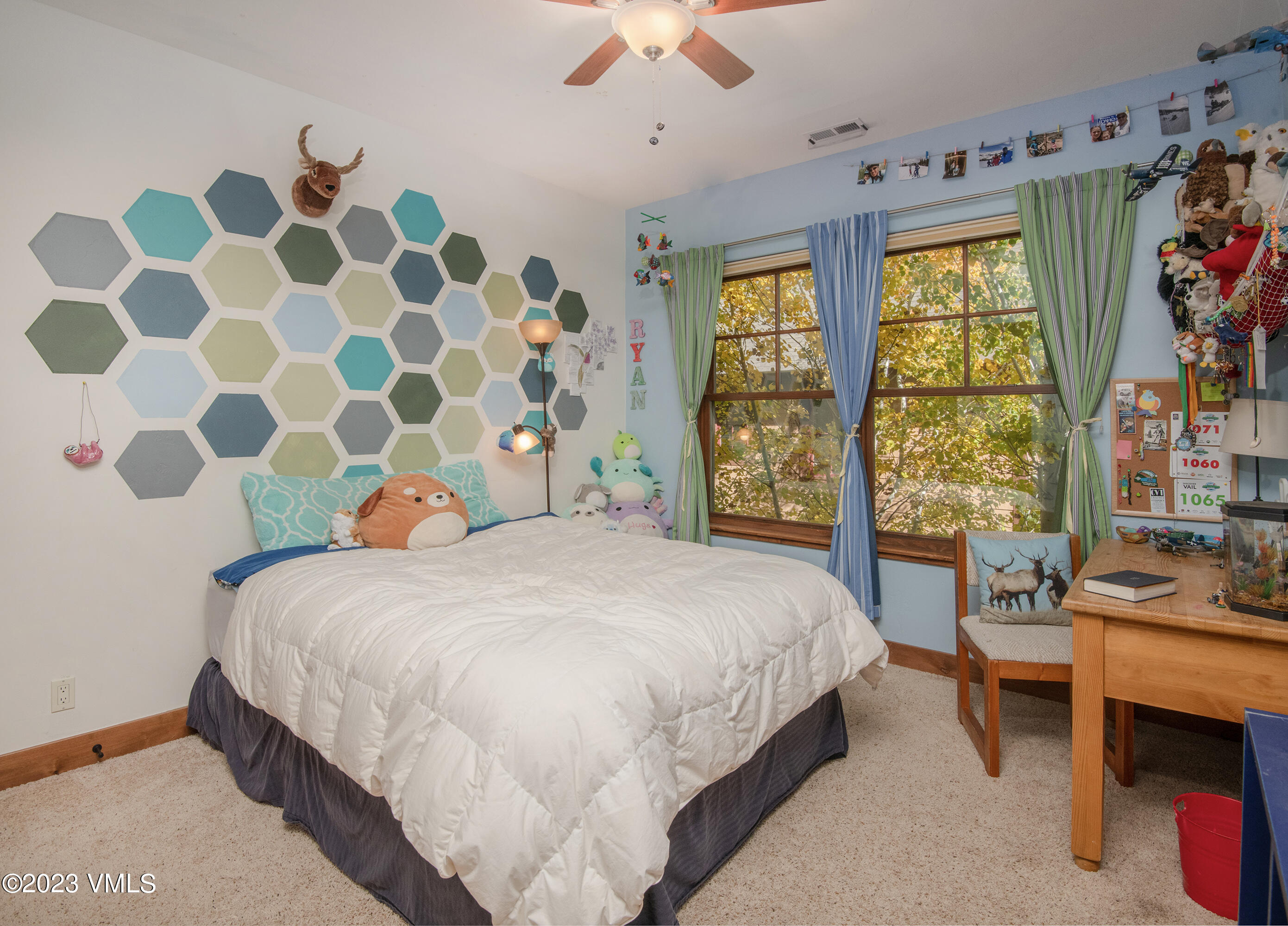 346 Palmer Loop Eagle, CO 81631 - Photo 30 of 63 a bedroom with a bed and a window