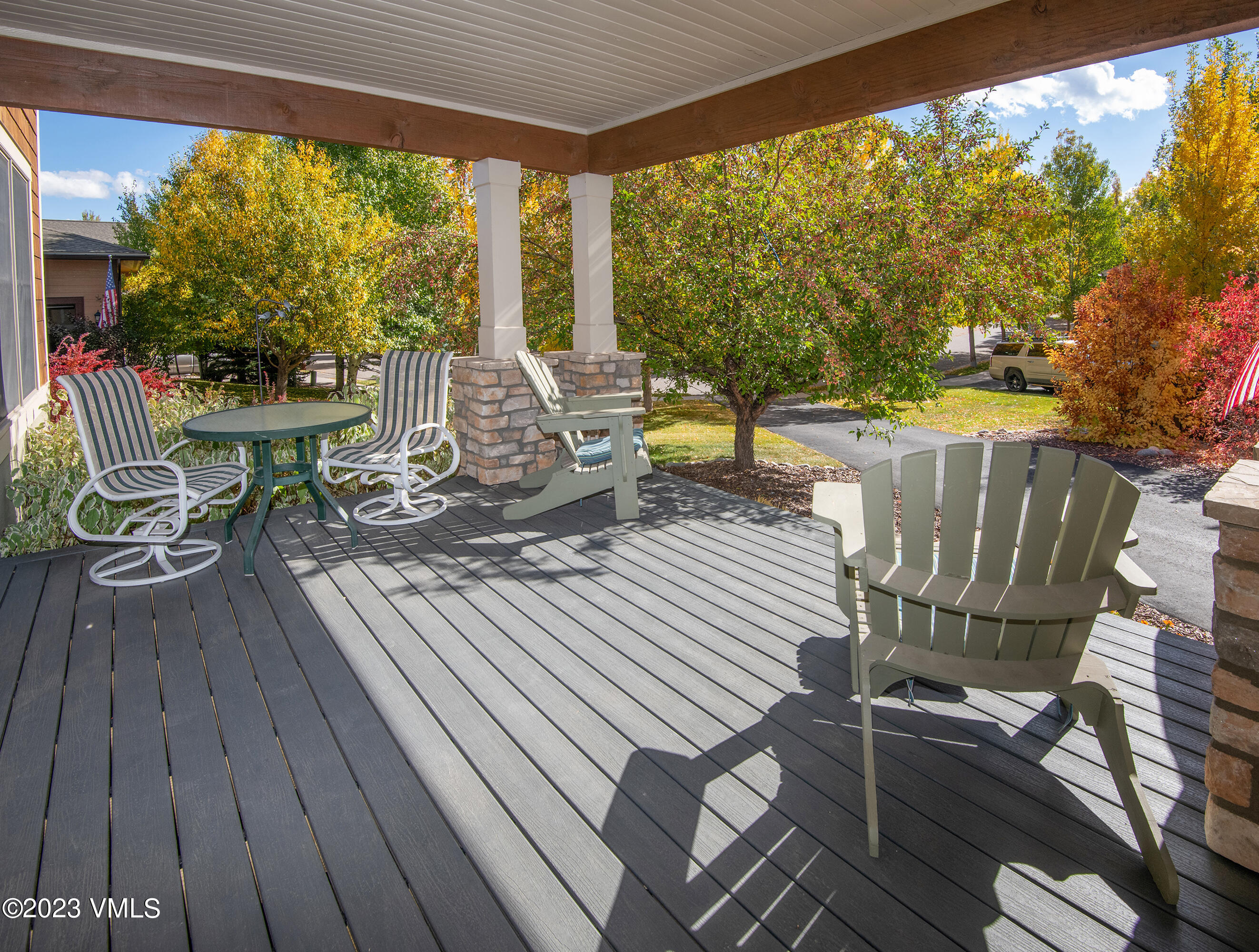 346 Palmer Loop Eagle, CO 81631 - Photo 47 of 63 a view of a patio with table and chairs and wooden floor