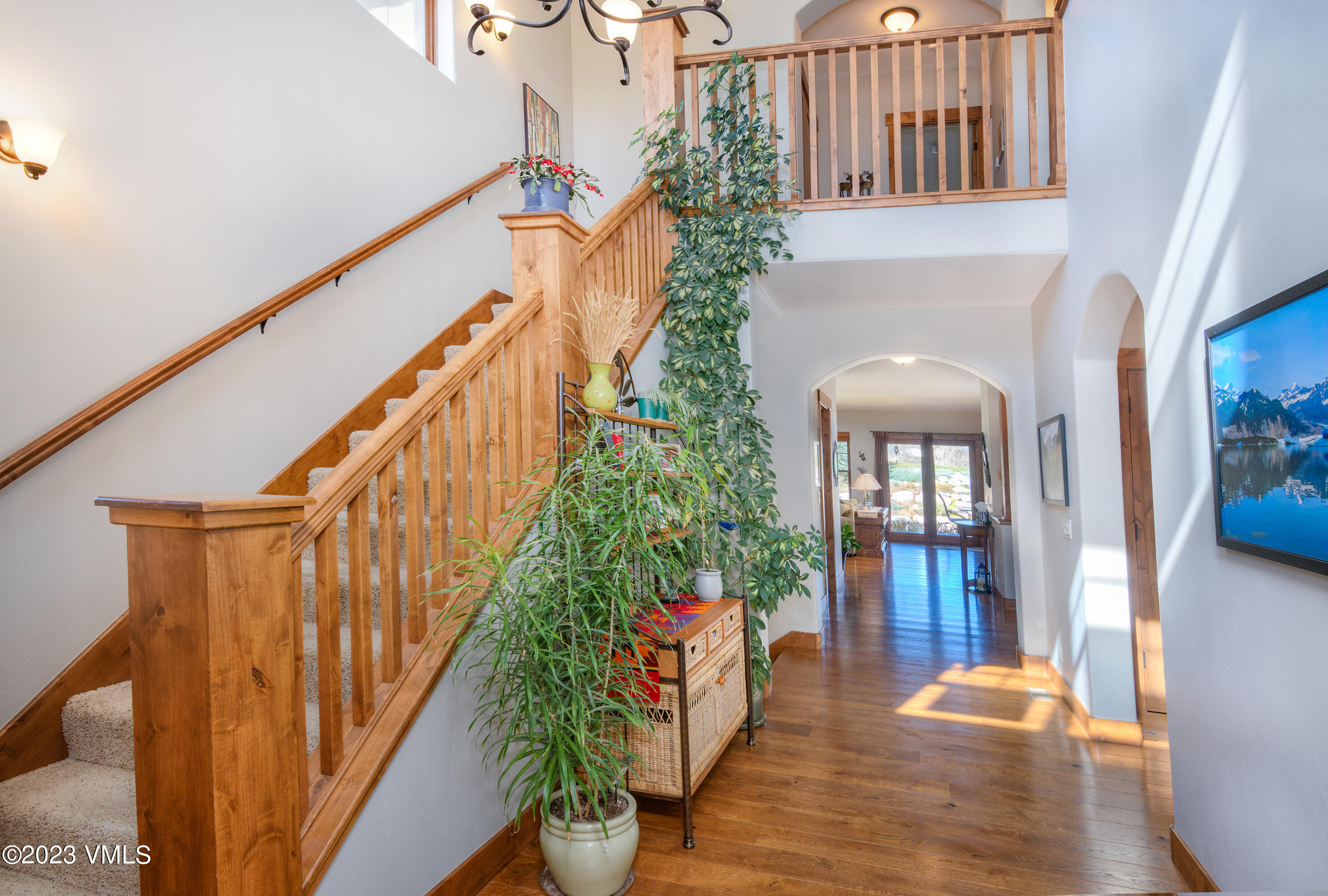 346 Palmer Loop Eagle, CO 81631 - Photo 5 of 63 a view of entryway and hall with wooden floor