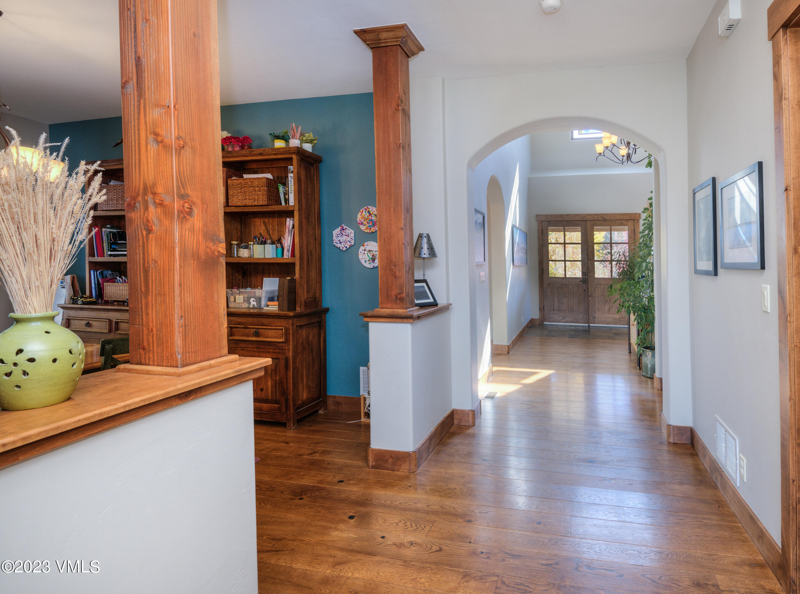 346 Palmer Loop Eagle, CO 81631 - Photo 8 of 63 a view of a hallway with wooden floor and furniture