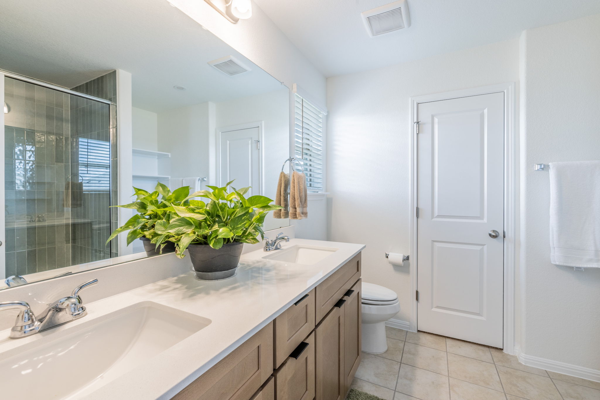 593 Backstays Loop Kyle, TX 78640 - Photo 10 of 26 a bathroom with a sink a toilet and a shower