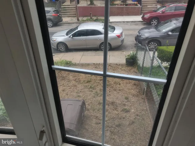 a view of a living room with wooden floor
